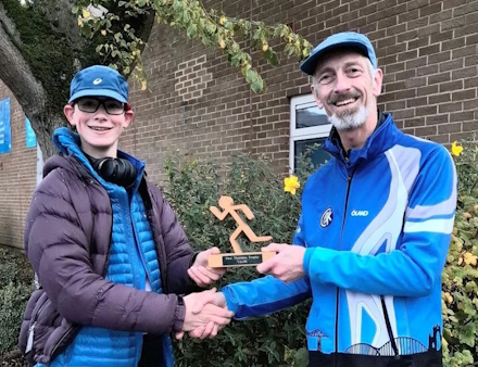 Photo of William Rowan receiving 
the Paul Thornton Trophy from Charles Mayes